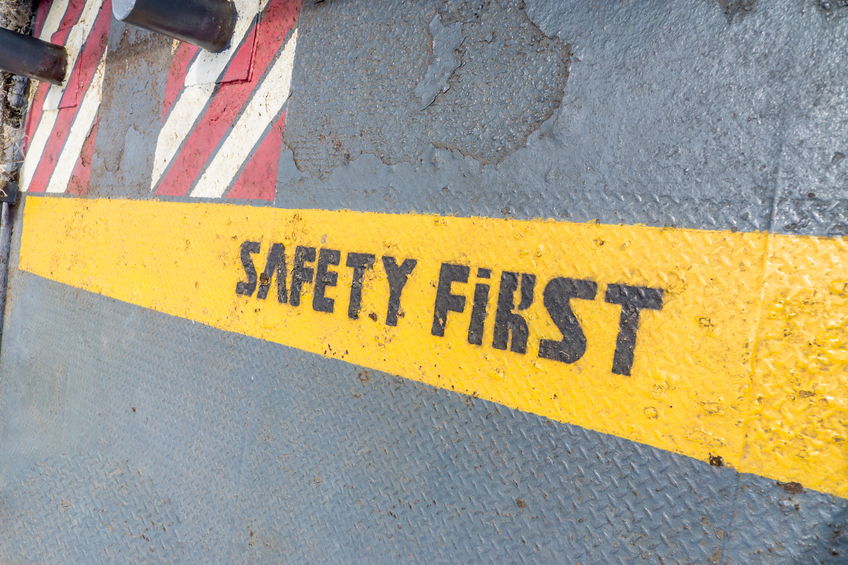 Safety First sign on caution strip.
